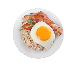 Photo of Tasty boiled oatmeal with fried egg, bacon and tomato isolated on white, top view