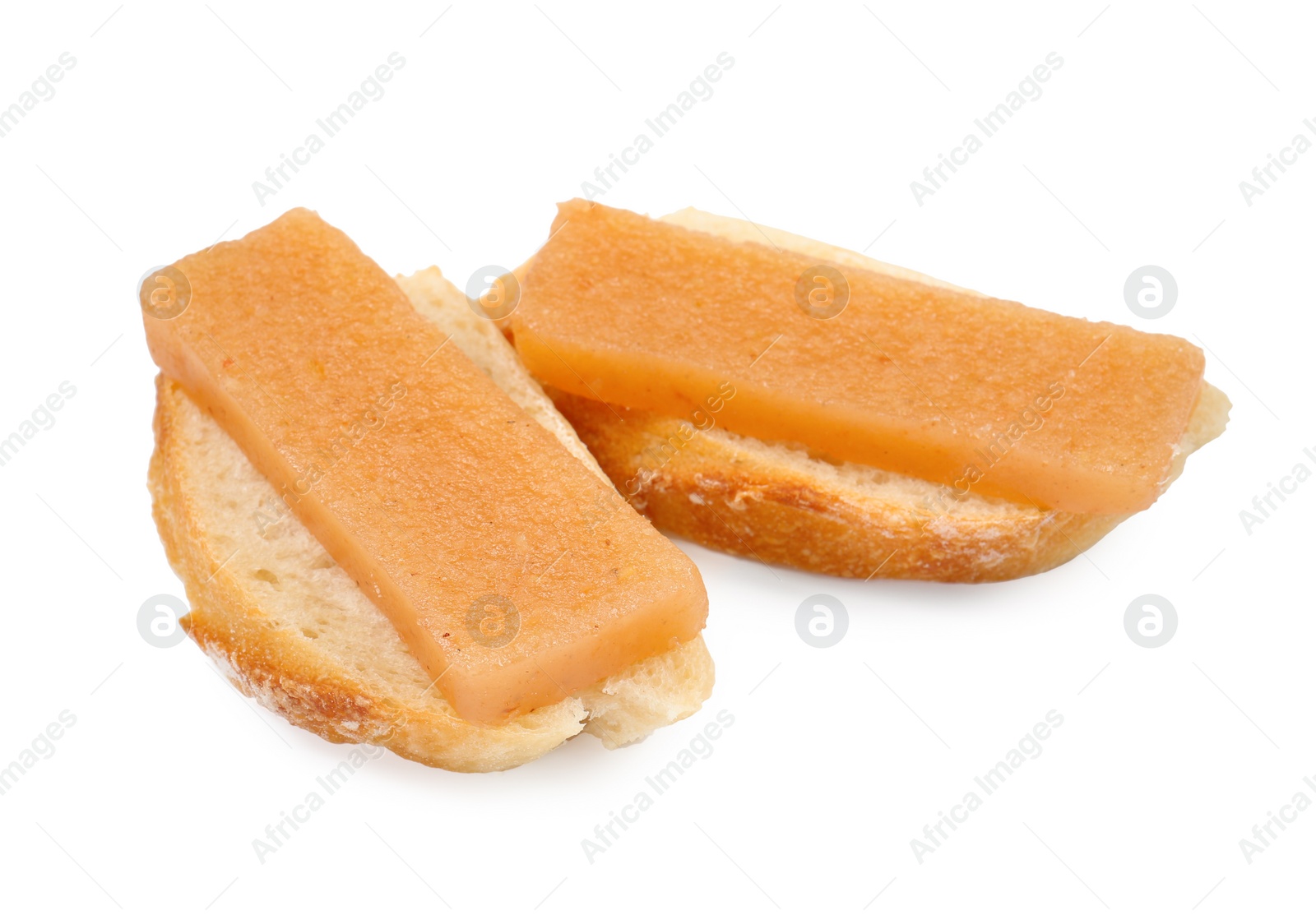 Photo of Bread with delicious sweet quince paste isolated on white