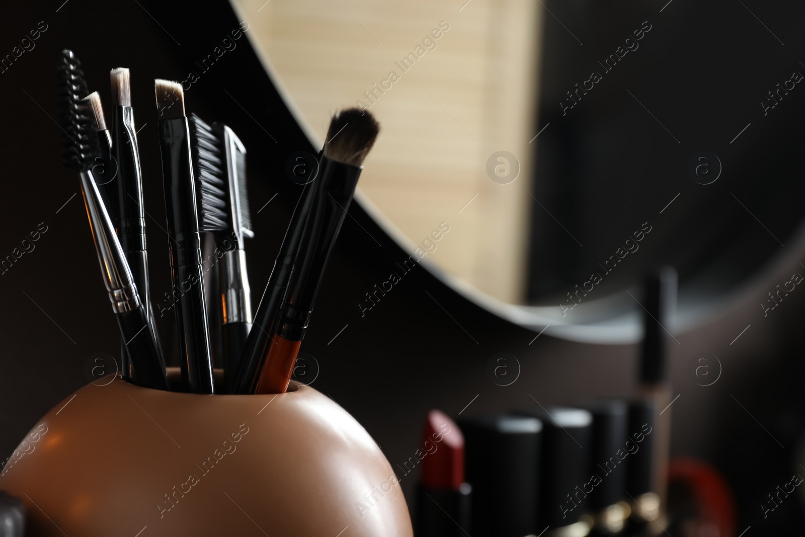 Photo of Dressing table with different cosmetic products, closeup. Space for text