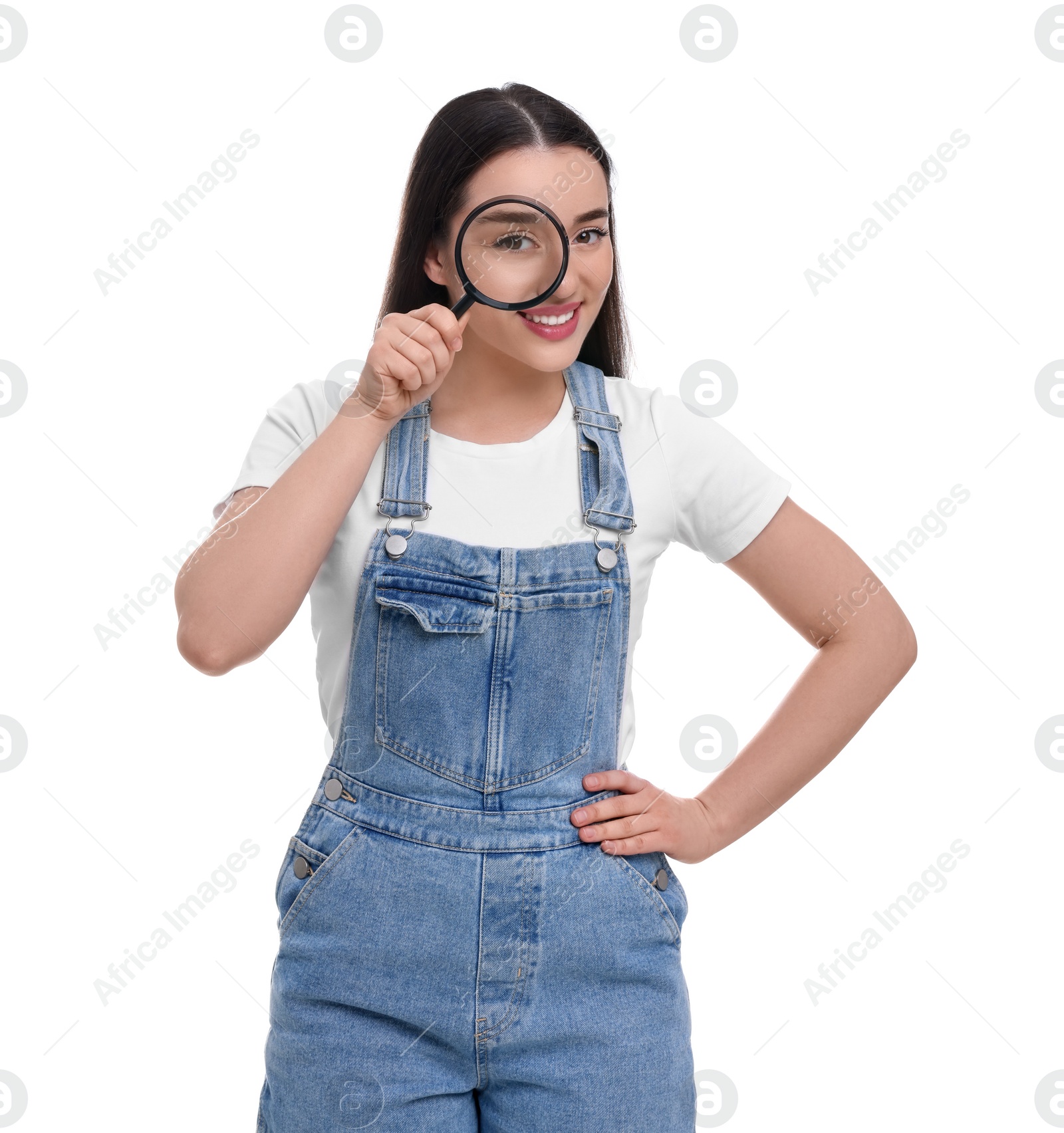 Photo of Happy young woman looking through magnifier glass on white background