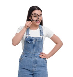 Happy young woman looking through magnifier glass on white background