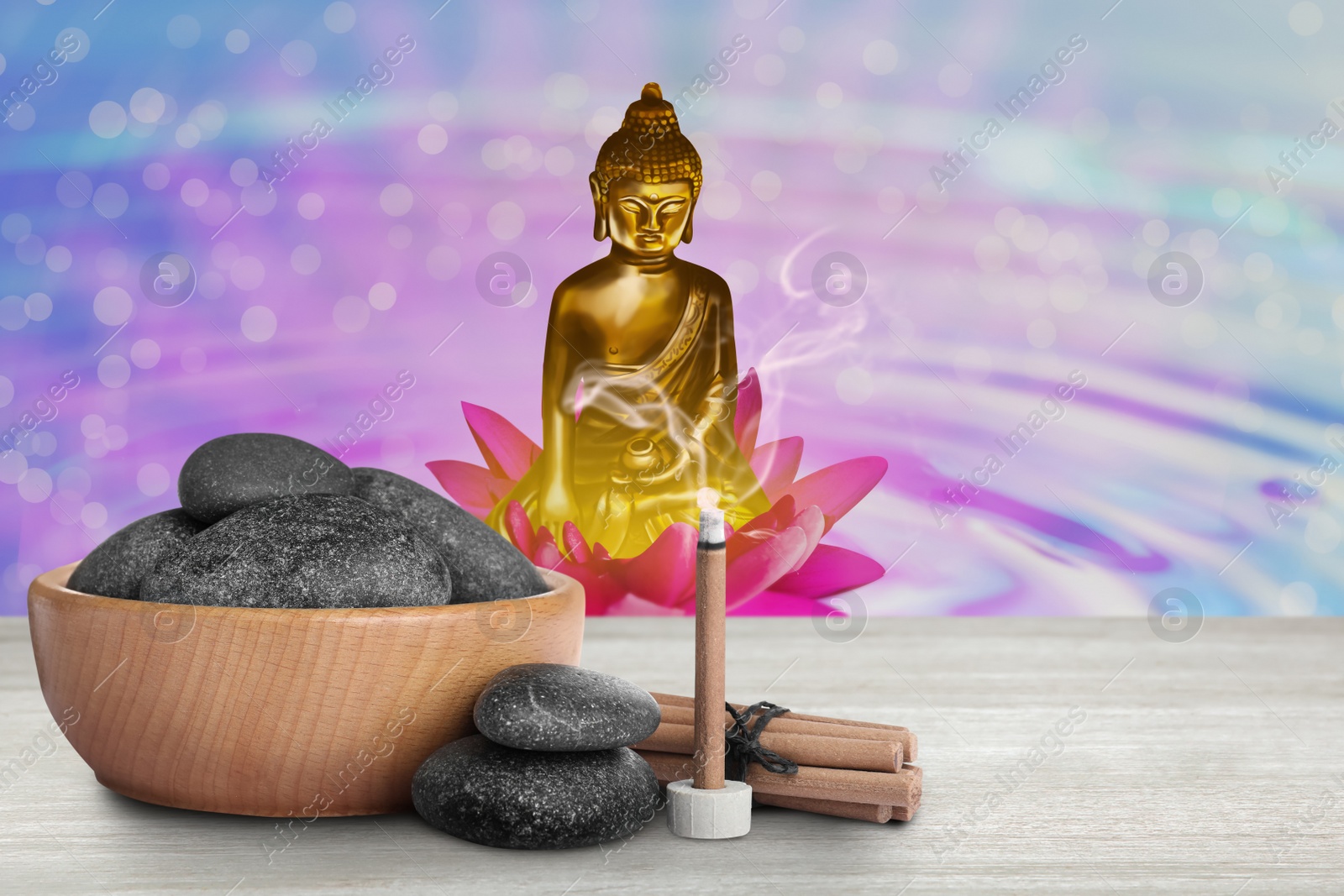 Image of Composition with smoldering incense stick on wooden table and Buddha figure on background