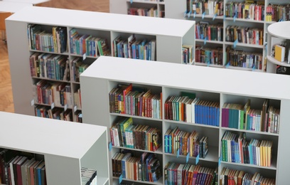 Above view of shelving units with books in library