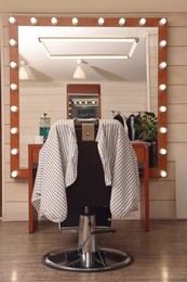Hairdressing salon interior with large mirror and chair