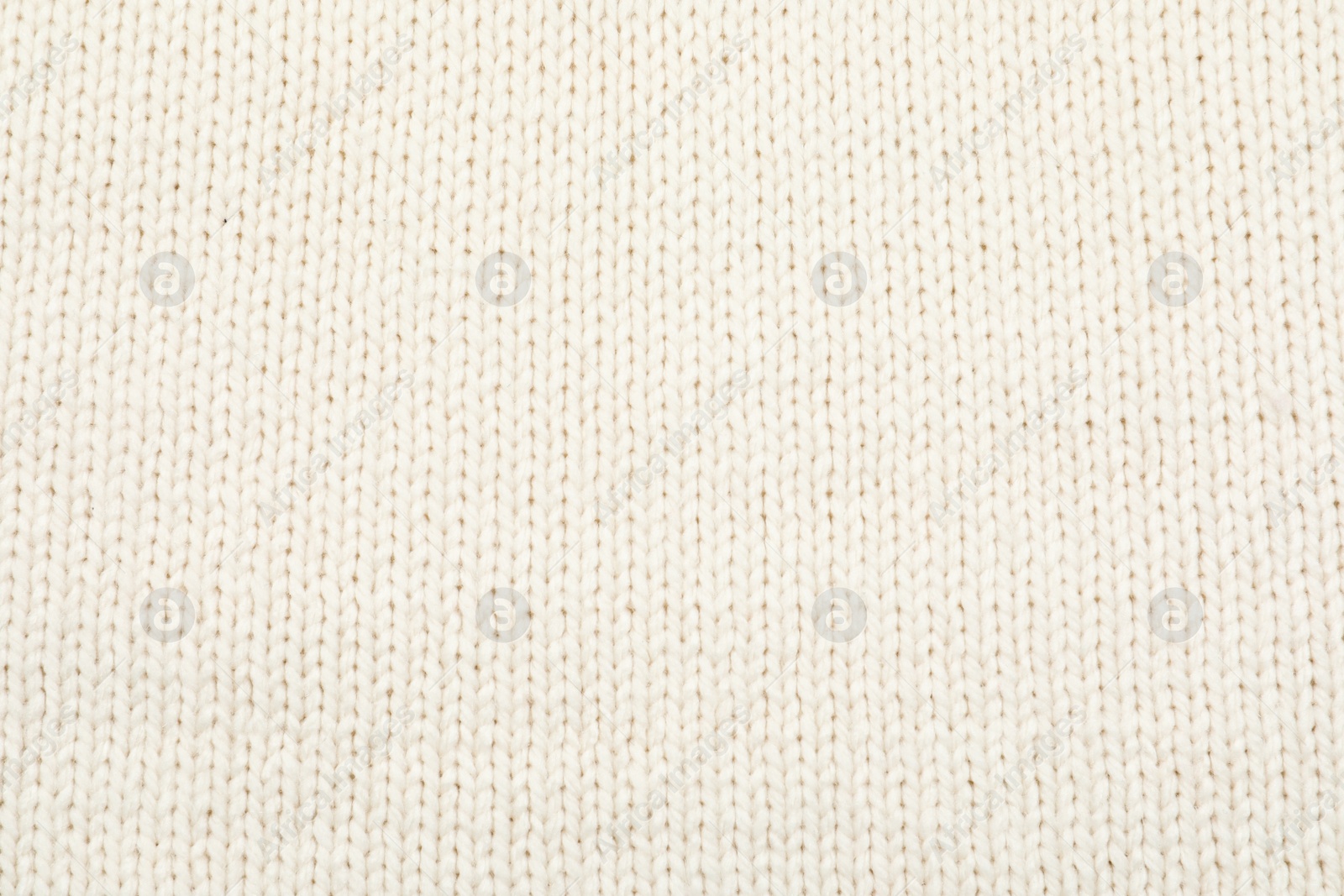 Photo of Texture of cozy warm sweater as background, closeup