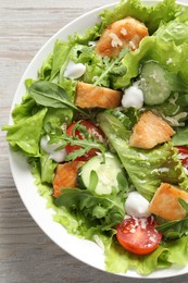 Delicious salad with chicken and vegetables on table, top view