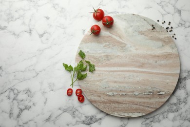 Photo of Cutting board, parsley, pepper and tomatoes on white marble table, flat lay. Space for text