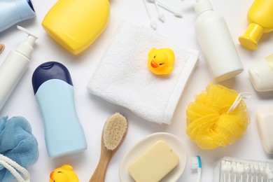 Photo of Baby bath accessories and care products on white background, flat lay