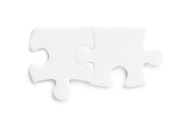 Photo of Blank puzzle pieces isolated on white, top view