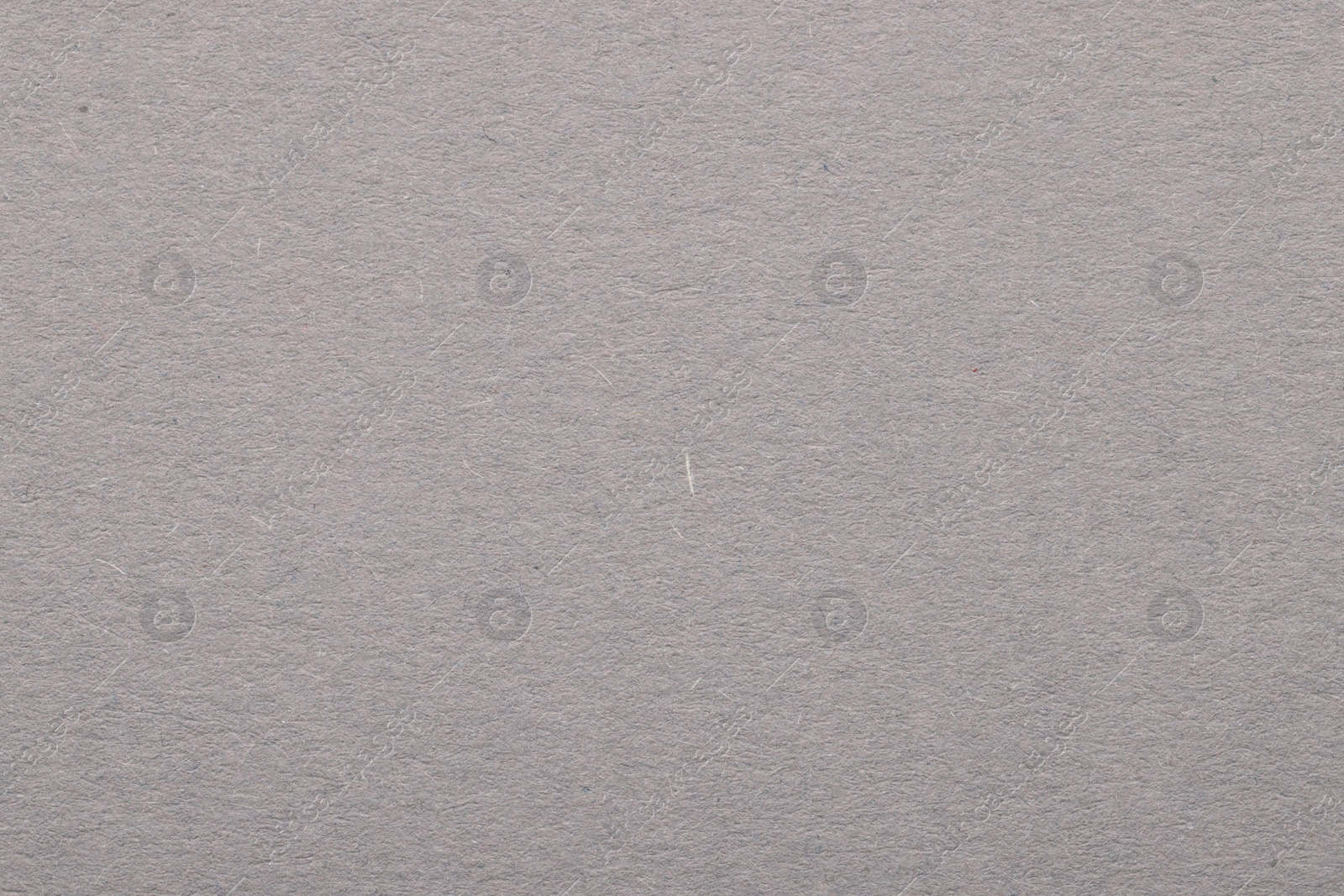 Photo of Texture of light grey paper sheet as background, top view