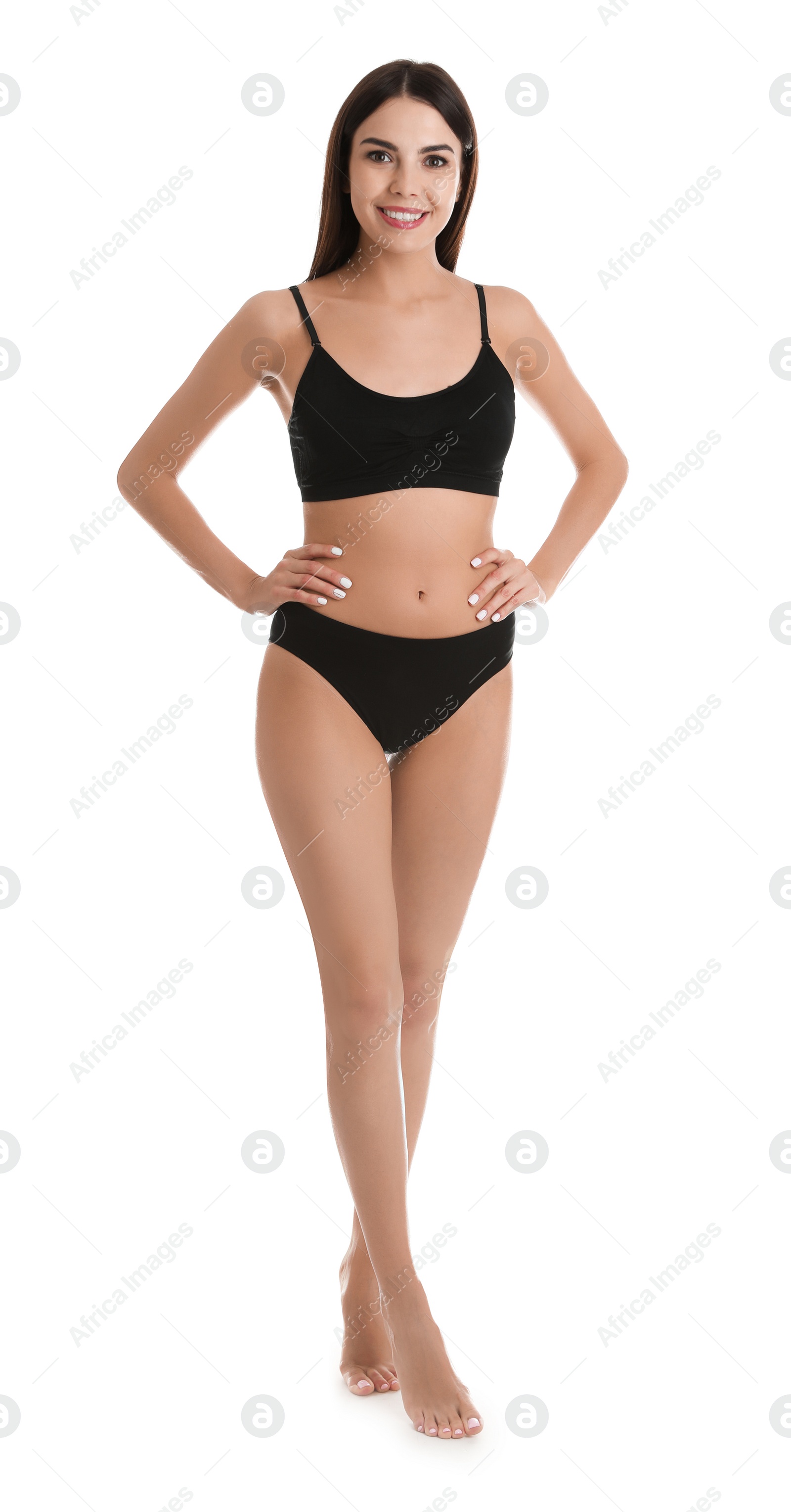 Photo of Full length portrait of attractive young woman with slim body in underwear on white background