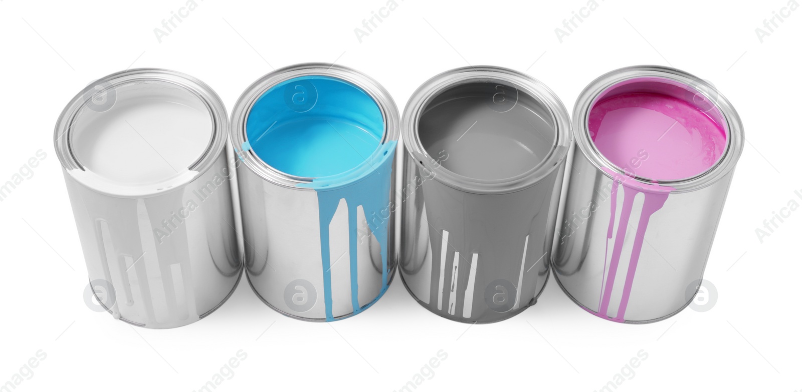 Photo of Cans of colorful paints isolated on white