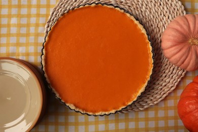 Photo of Delicious homemade pie and pumpkins on table, flat lay