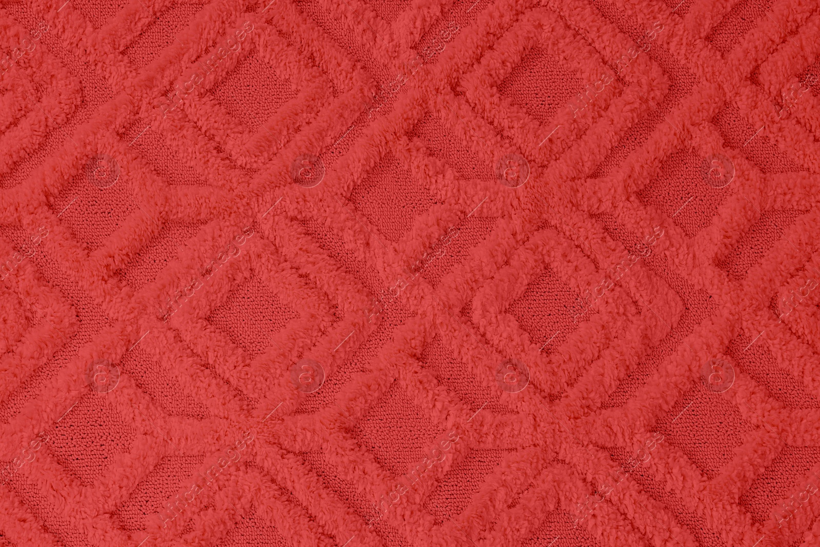 Image of Soft red carpet with pattern as background, top view