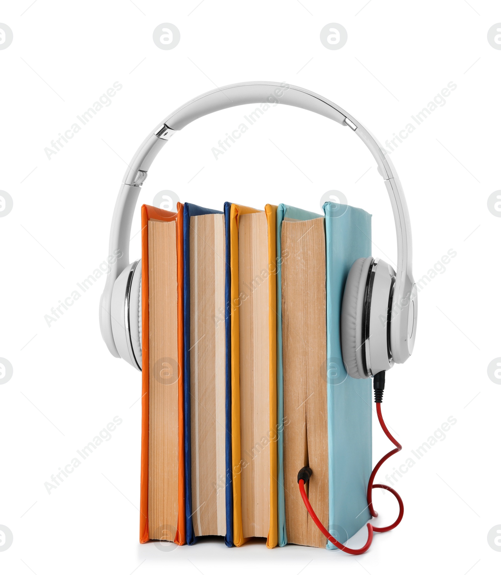 Photo of Books with modern headphones isolated on white