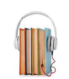 Photo of Books with modern headphones isolated on white