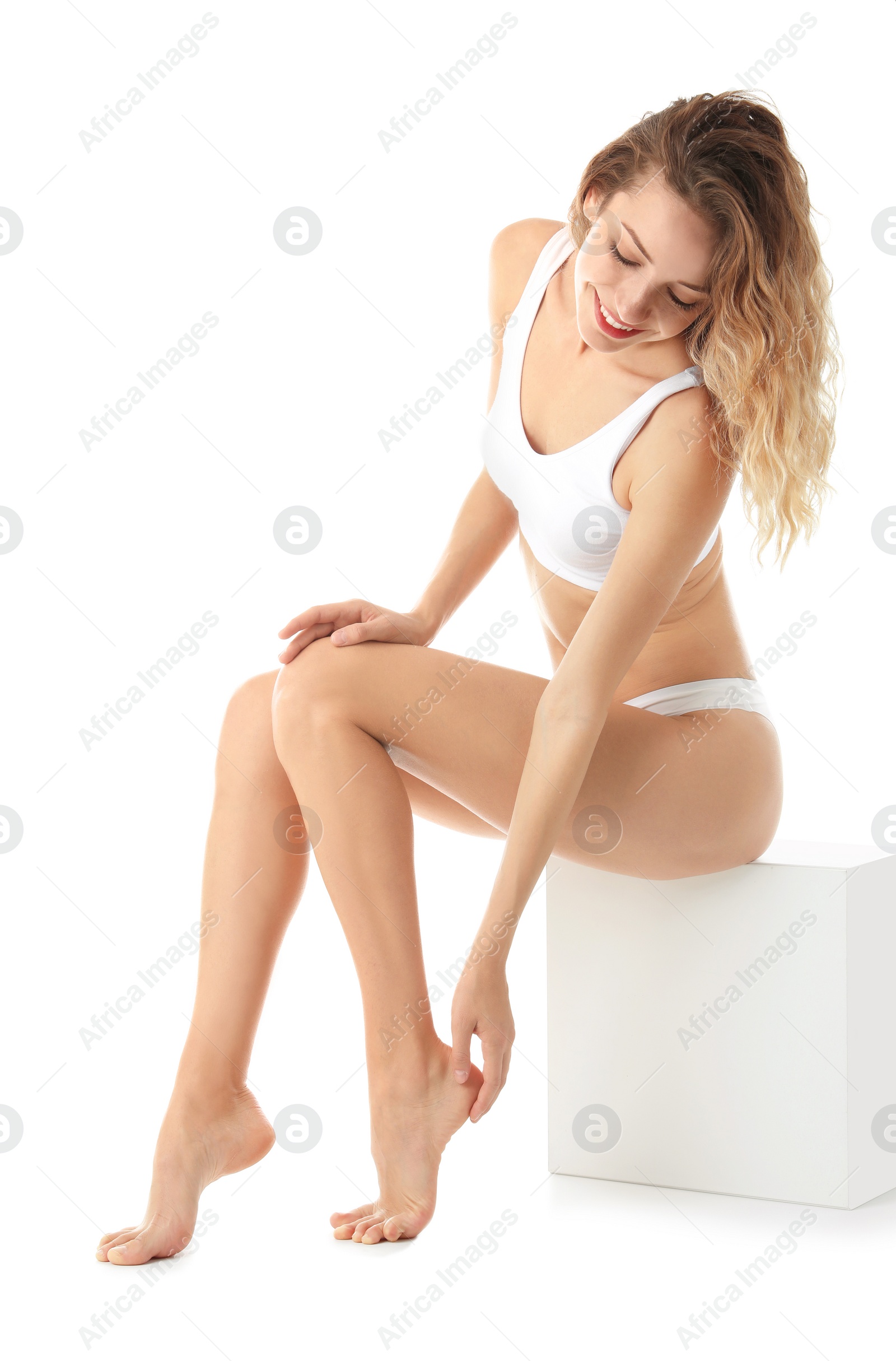 Photo of Young woman with beautiful long legs on white background