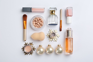 Photo of Flat lay composition with decorative cosmetic products on light background. Winter care