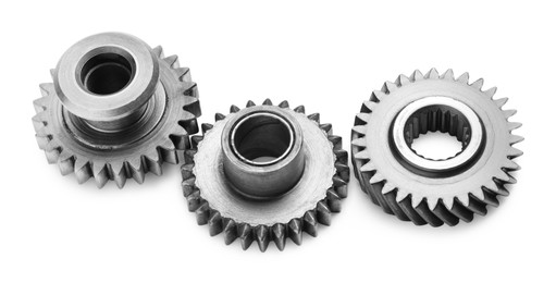 Photo of Different stainless steel gears on white background