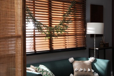 Stylish room decorated with beautiful eucalyptus garland