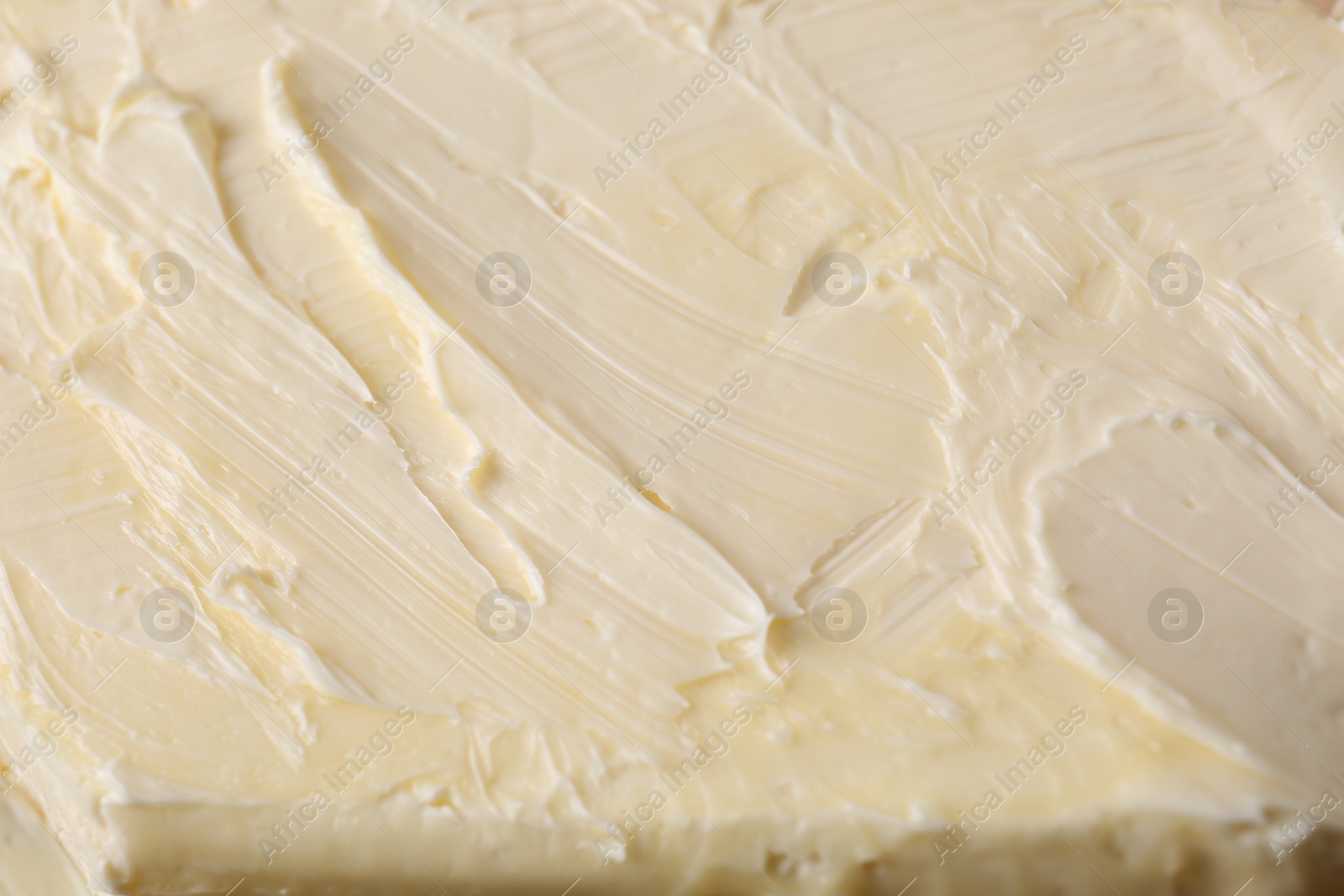 Photo of Piece of tasty homemade butter as background, closeup