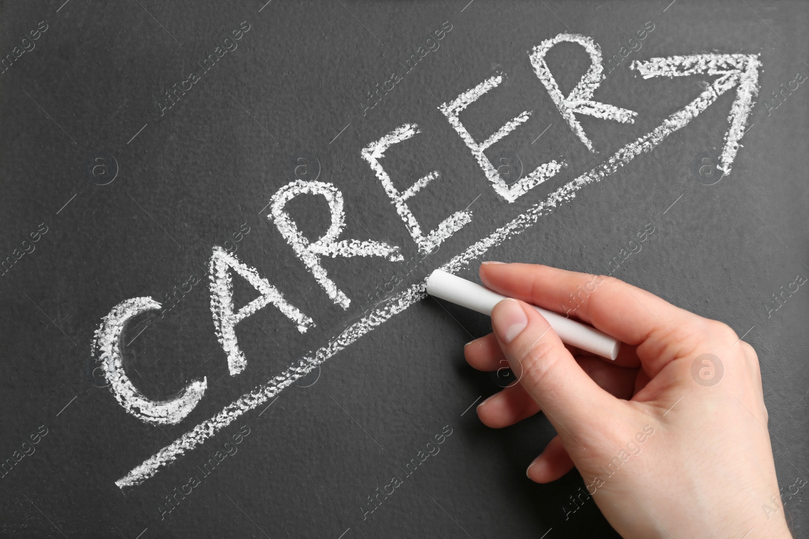 Photo of Woman drawing arrow on chalkboard, closeup. Career promotion concept