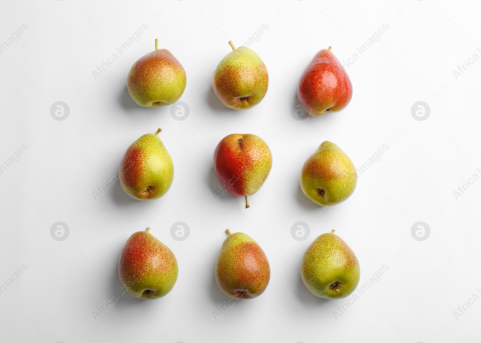 Photo of Ripe juicy pears on white background, top view