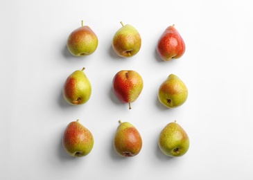 Ripe juicy pears on white background, top view