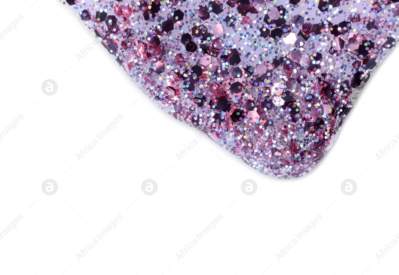 Photo of Nail polish with glitter flowing on white background