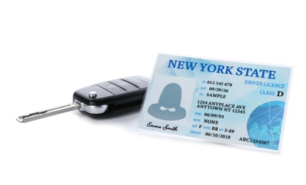 Photo of American driving license and car key on white background