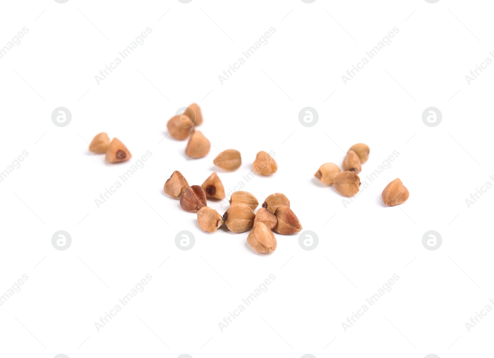 Photo of Uncooked buckwheat on white background. Healthy diet