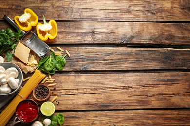 Photo of Flat lay composition with fresh products on wooden table, space for text. Healthy cooking