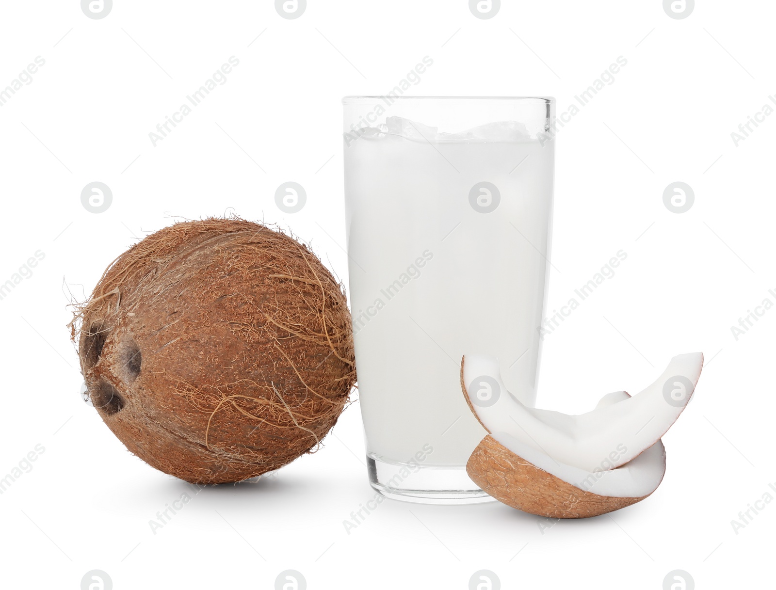 Photo of Glass of coconut water, ice cubes and nuts isolated on white