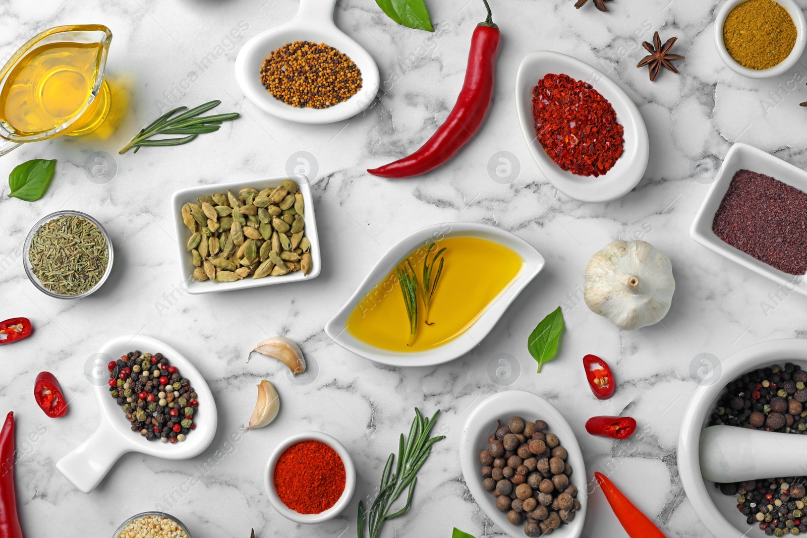 Photo of Flat lay composition with different aromatic spices on marble background