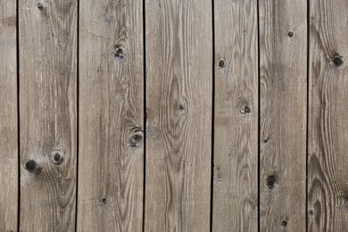 Photo of Row of wooden planks as background, fence texture