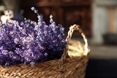 Wicker basket with beautiful lavender flowers outdoors, closeup