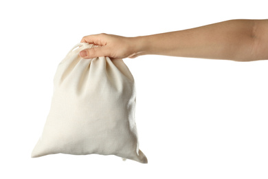 Photo of Woman holding full cotton eco bag on white background, closeup