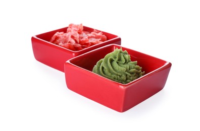 Photo of Bowls with swirl of wasabi paste and pickled ginger on white background