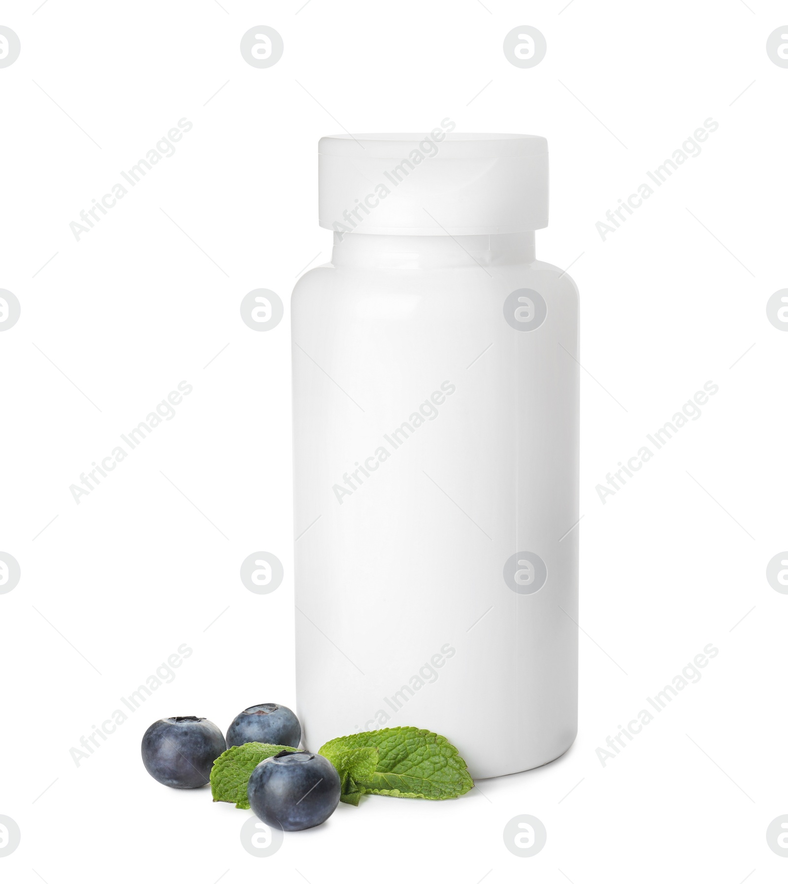 Photo of Bottle with vitamin pills, mint and blueberries on white background
