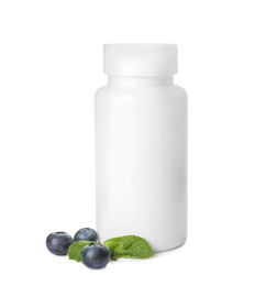 Bottle with vitamin pills, mint and blueberries on white background