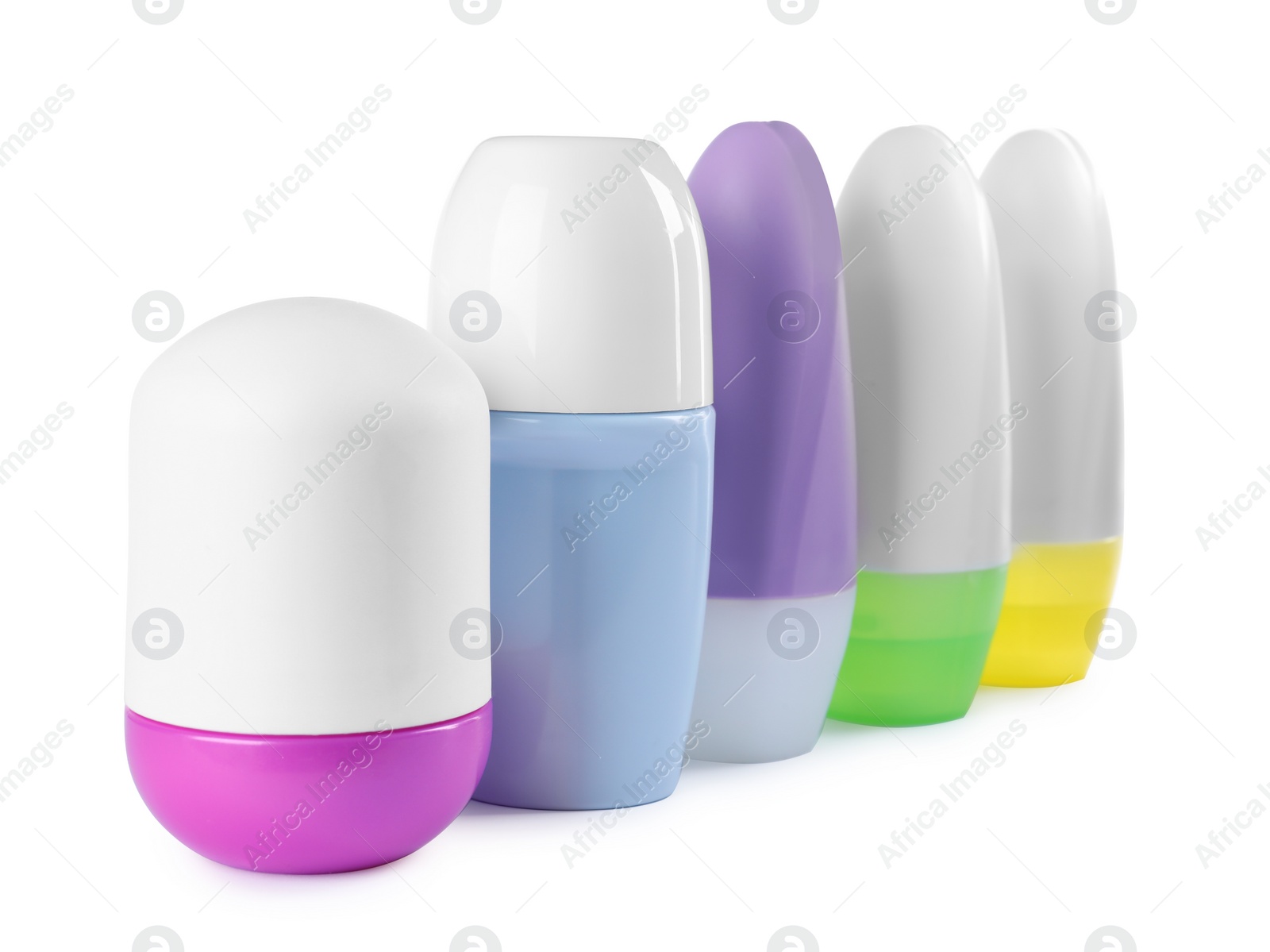 Photo of Different female roll-on deodorants on white background. Skin care