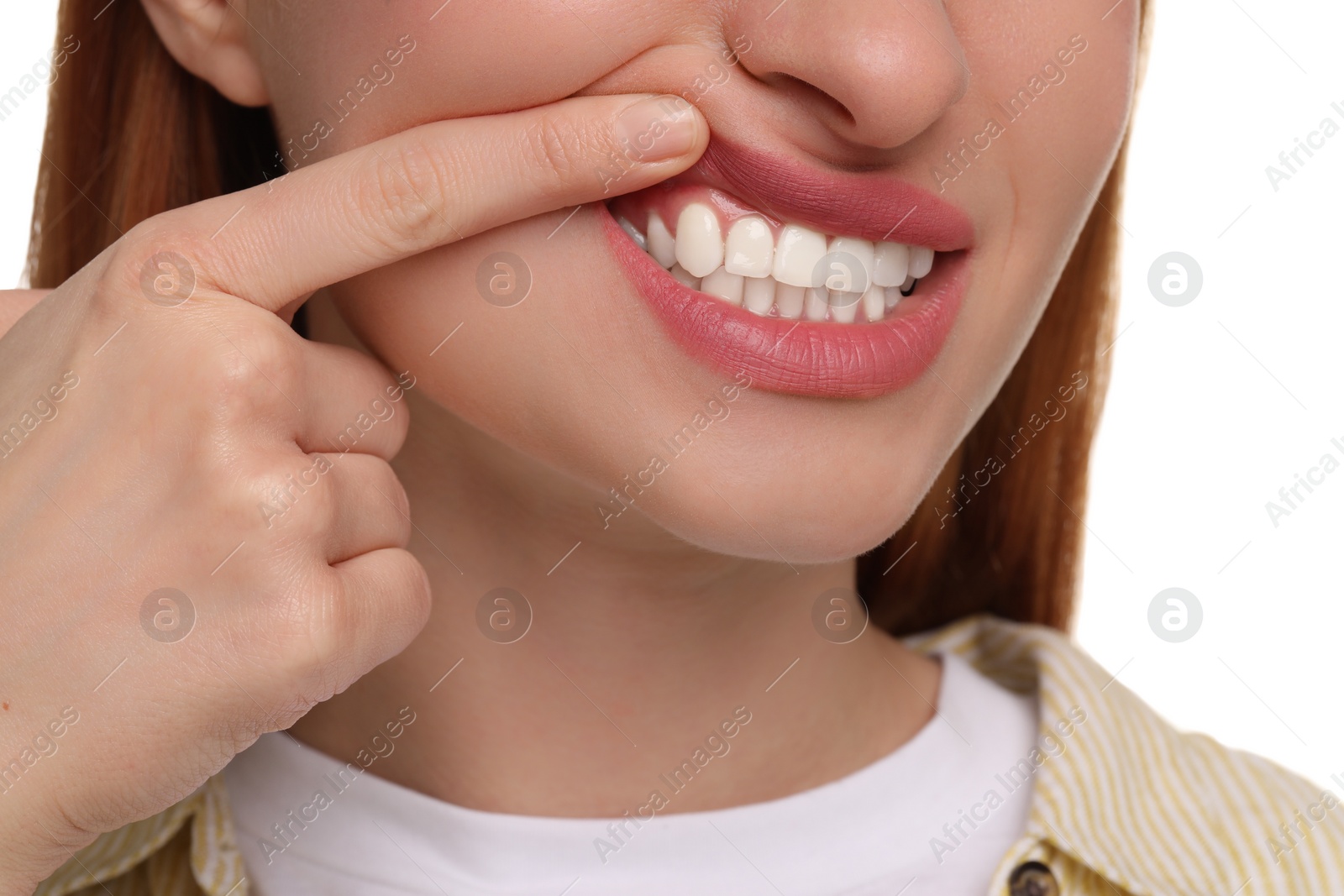 Photo of Woman showing her clean teeth on white background, closeup