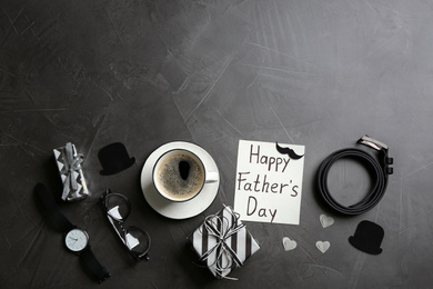 Photo of Flat lay composition with greeting card on grey background, space for text. Happy Father's Day