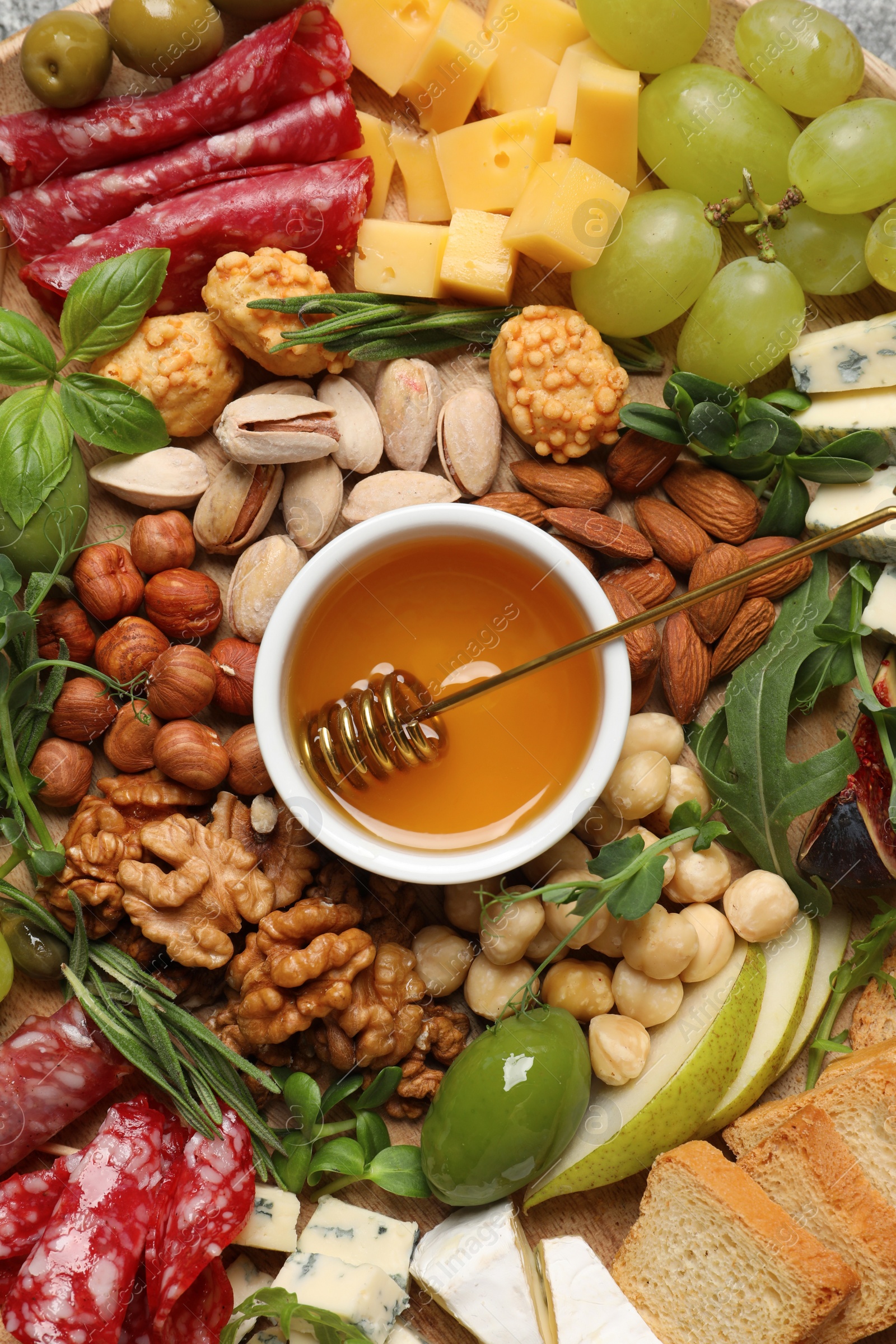 Photo of Different tasty appetizers as background, top view