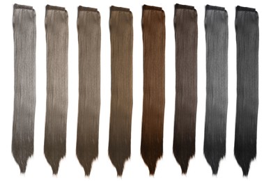 Image of Strands of different beautiful hair on white background, top view