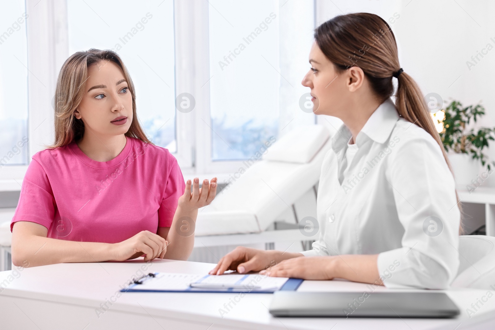 Photo of Mammologist's appointment. Doctor and woman in hospital