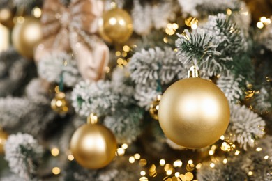 Photo of Beautiful decorated Christmas tree with baubles and lights as background, closeup