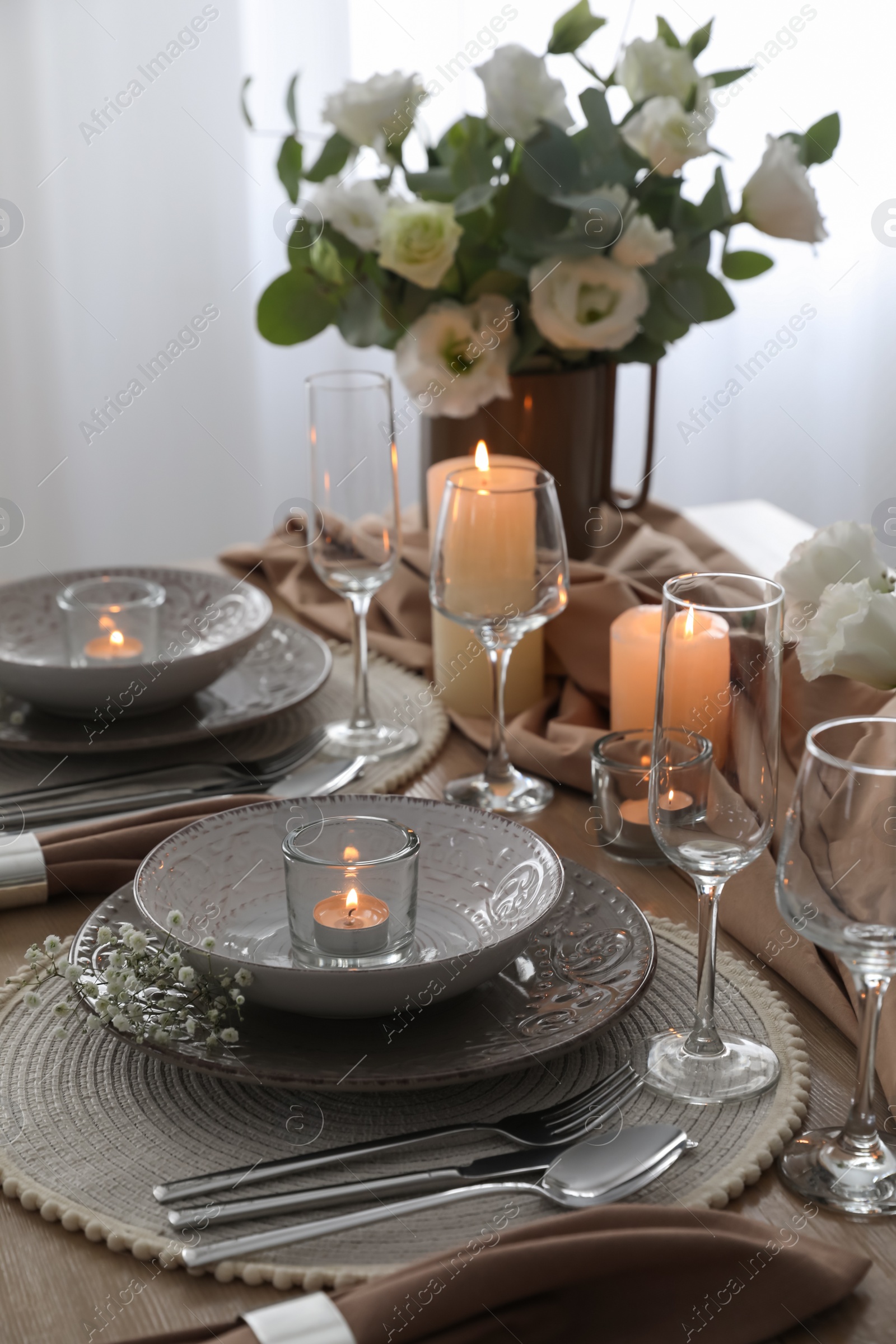 Photo of Festive table setting with beautiful floral decor in restaurant