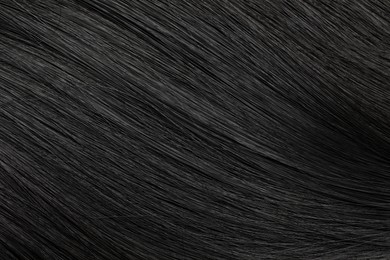 Photo of Beautiful black hair as background, closeup view