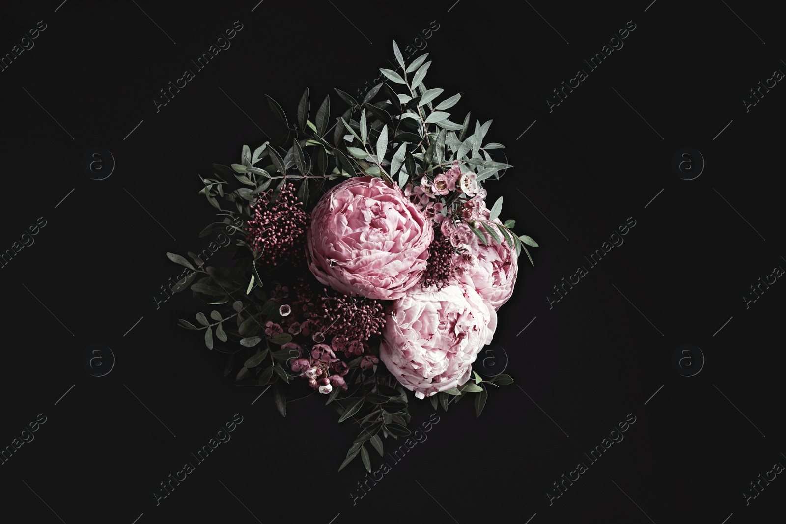 Photo of Bouquet of beautiful flowers on black background. Floral card design with dark vintage effect